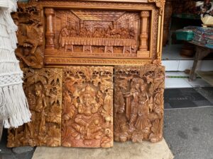 Religions depicted in woodwork stand side by side