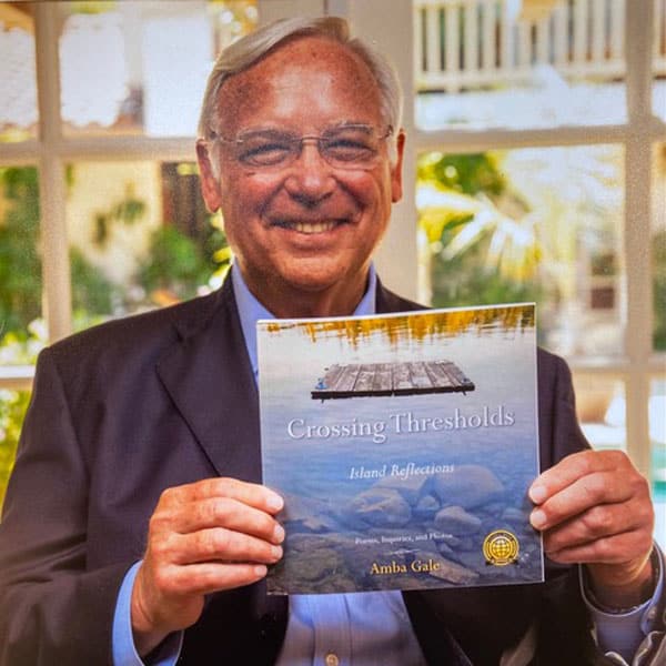 Jack holding Amba's Crossing Thresholds book